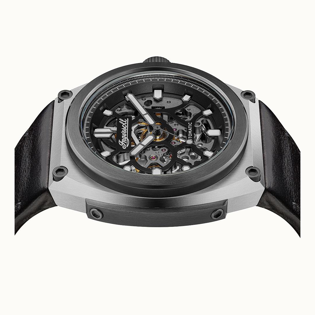 Men's automatic skeleton dial watch with black leather strap, steel bezel and crown