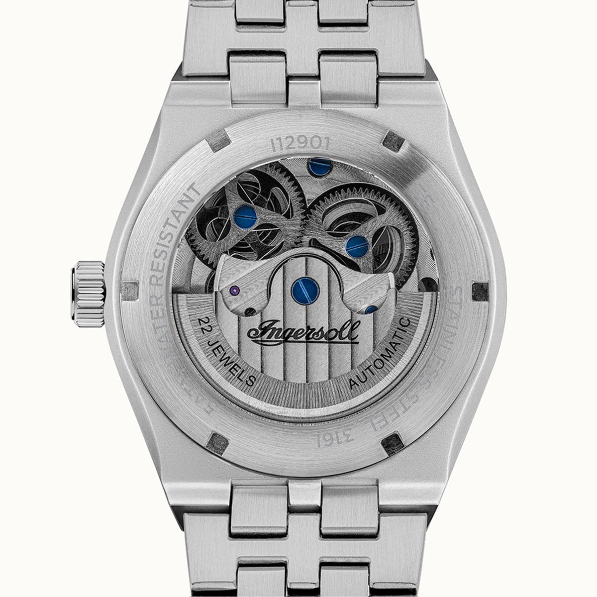 Stainless steel automatic watch caseback showing exposed movement and blue jewel details