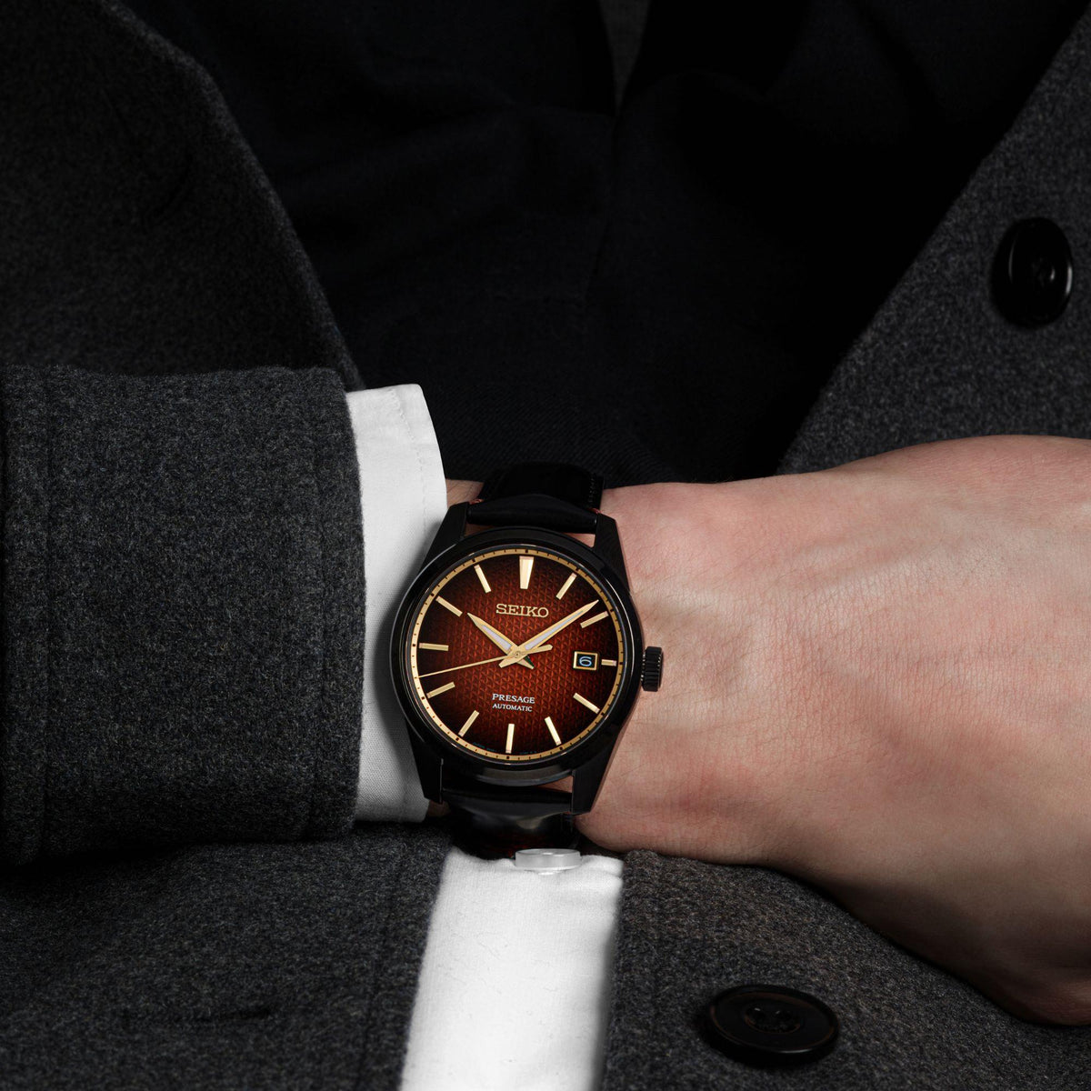Men's Seiko Presage watch with red dial and black leather strap, sharp-edged case