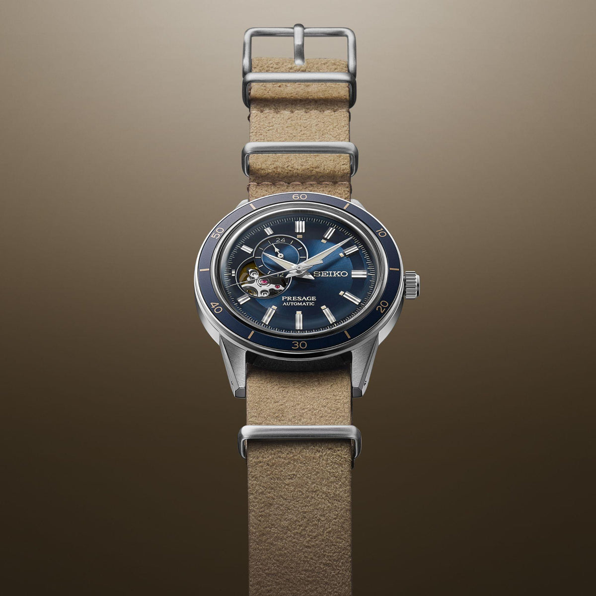 Blue-dial automatic wristwatch on beige leather strap with round silver case