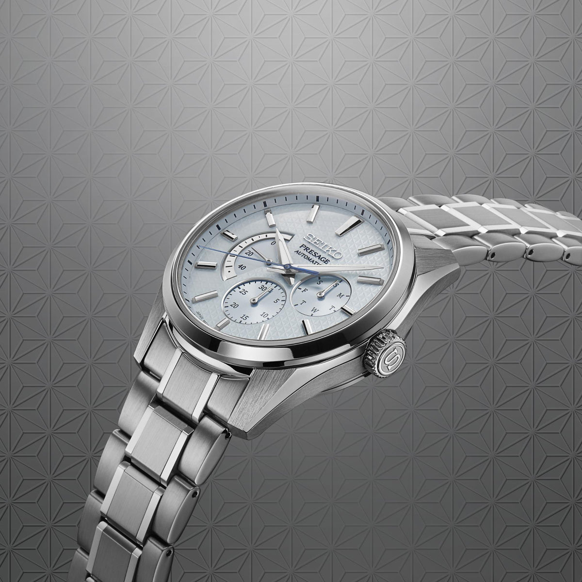 Seiko Presage men's automatic watch side view, blue dial and stainless steel bracelet