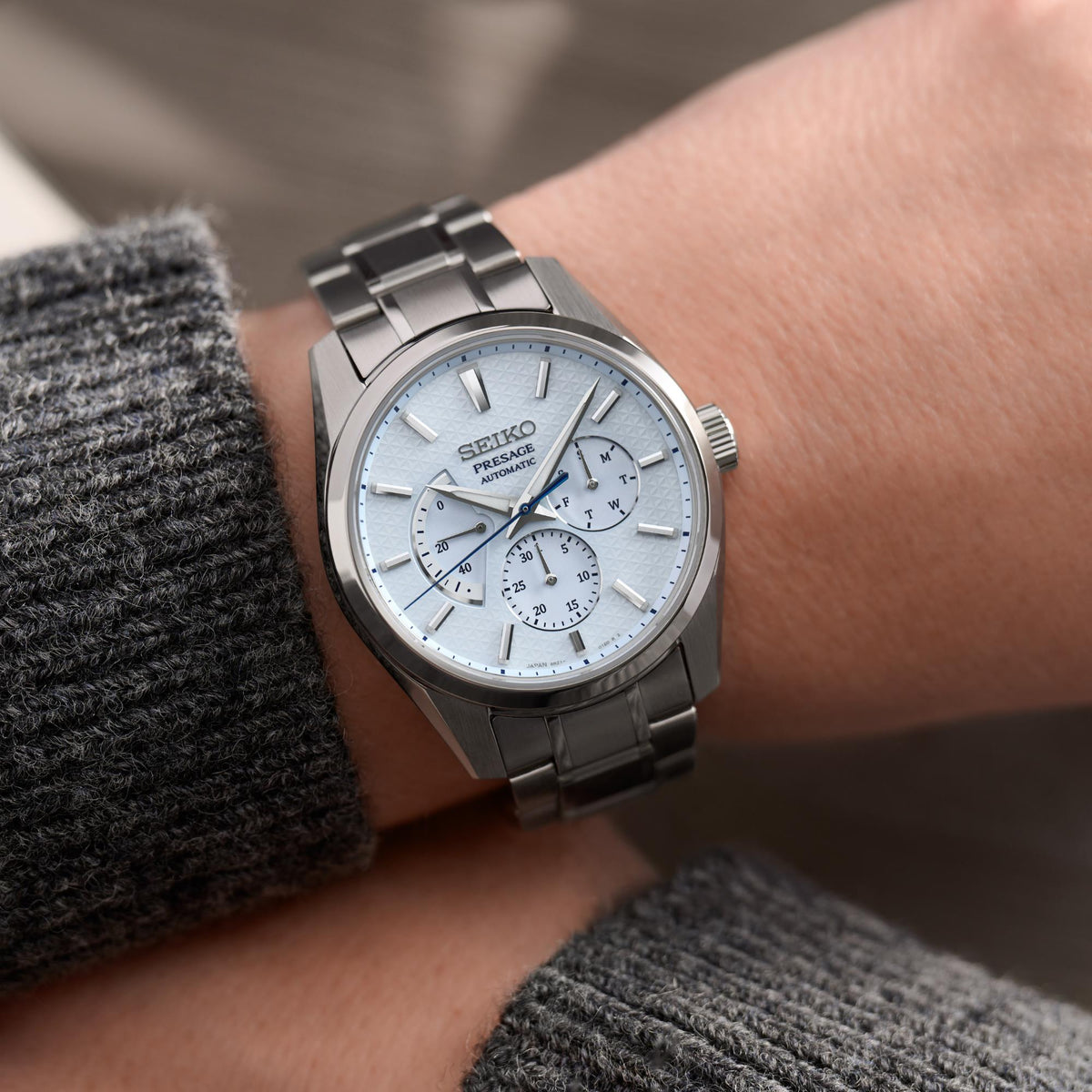 Seiko Presage men's automatic watch on wrist, blue dial with three chronograph subdials