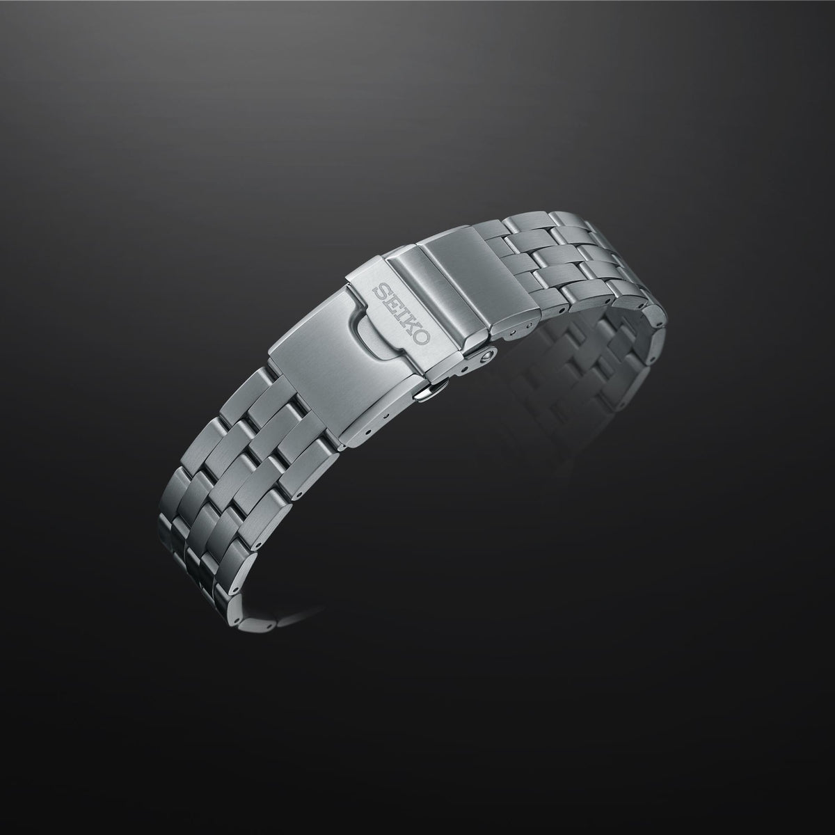 Stainless steel watch bracelet and clasp, angled side view