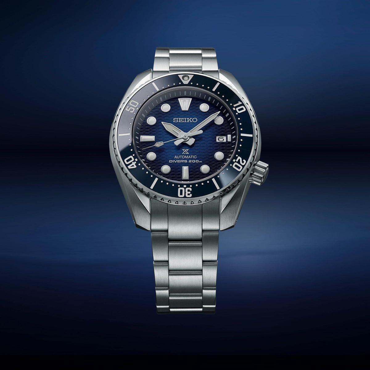 Seiko men's automatic divers watch, blue dial, steel bracelet, three-quarter angle