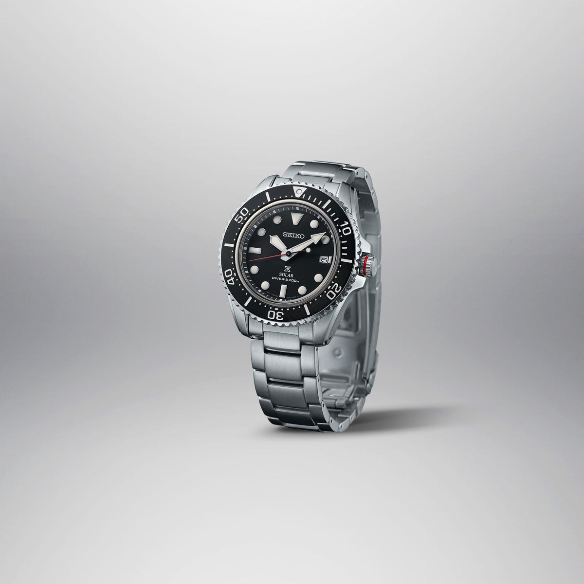 Seiko Prospex solar quartz diver watch with black dial and stainless bracelet, angled