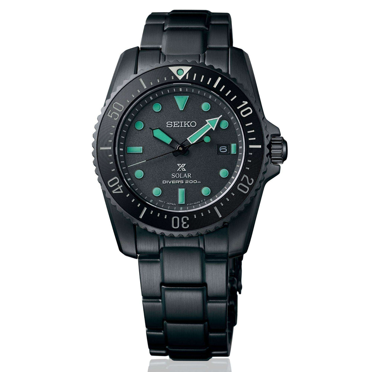 Black solar diver watch with green-accent markers on black dial
