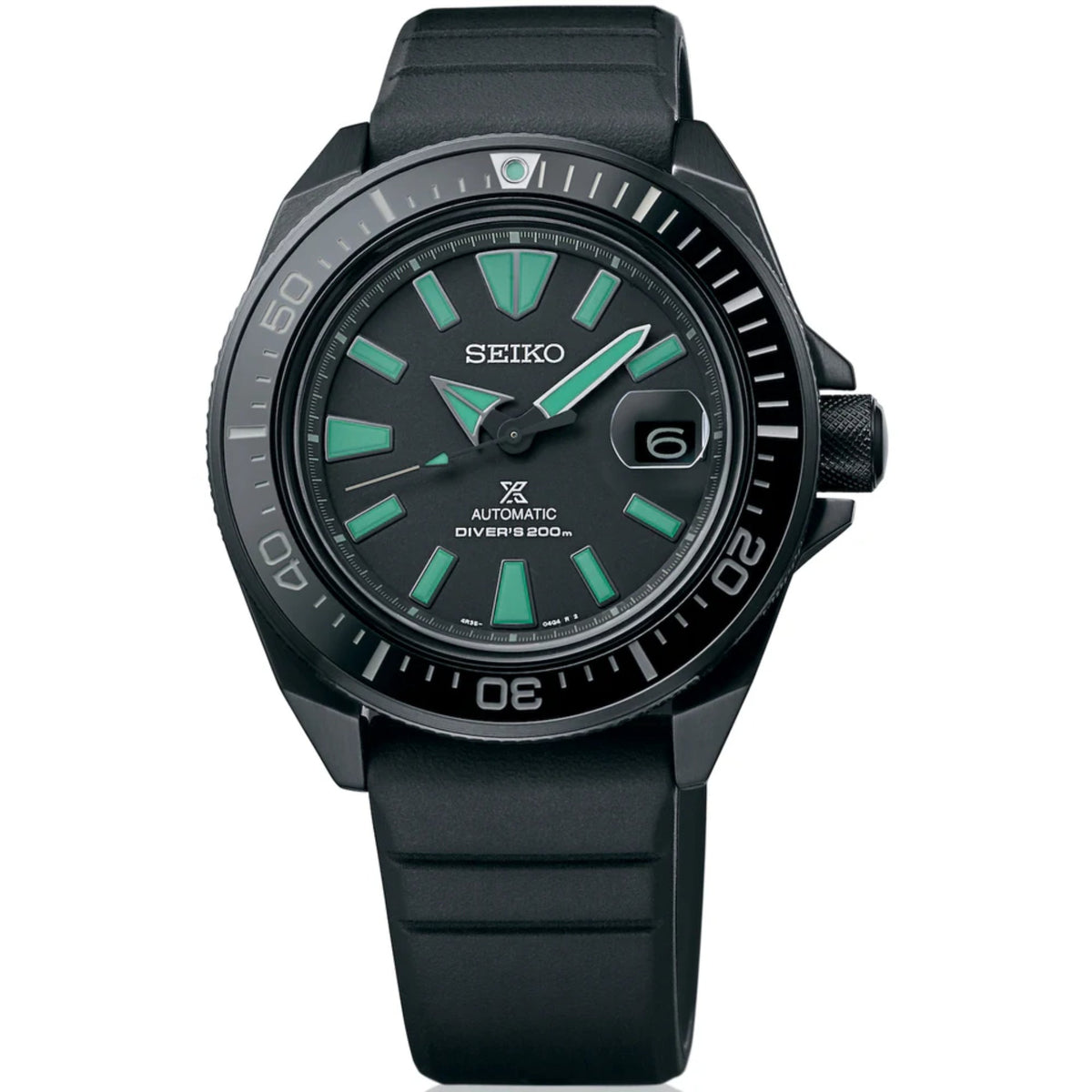 Front view Seiko diver watch in black with green markers, black rubber strap, automatic