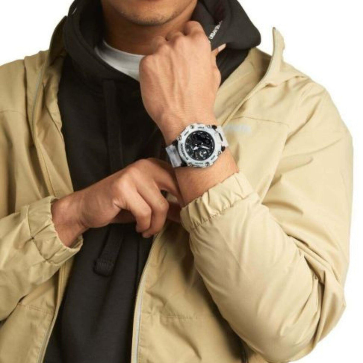 Men's dual-display watch worn on wrist featuring white snow-camo strap and black face