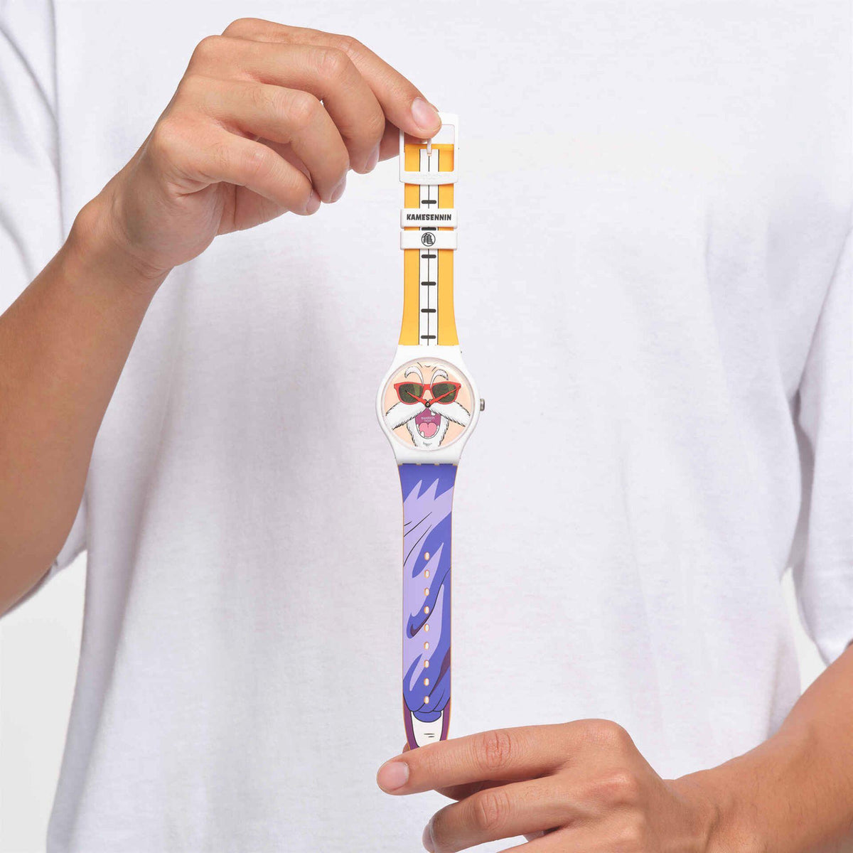 Swatch watch on wrist, showing Kamesennin face dial and blue-purple band.