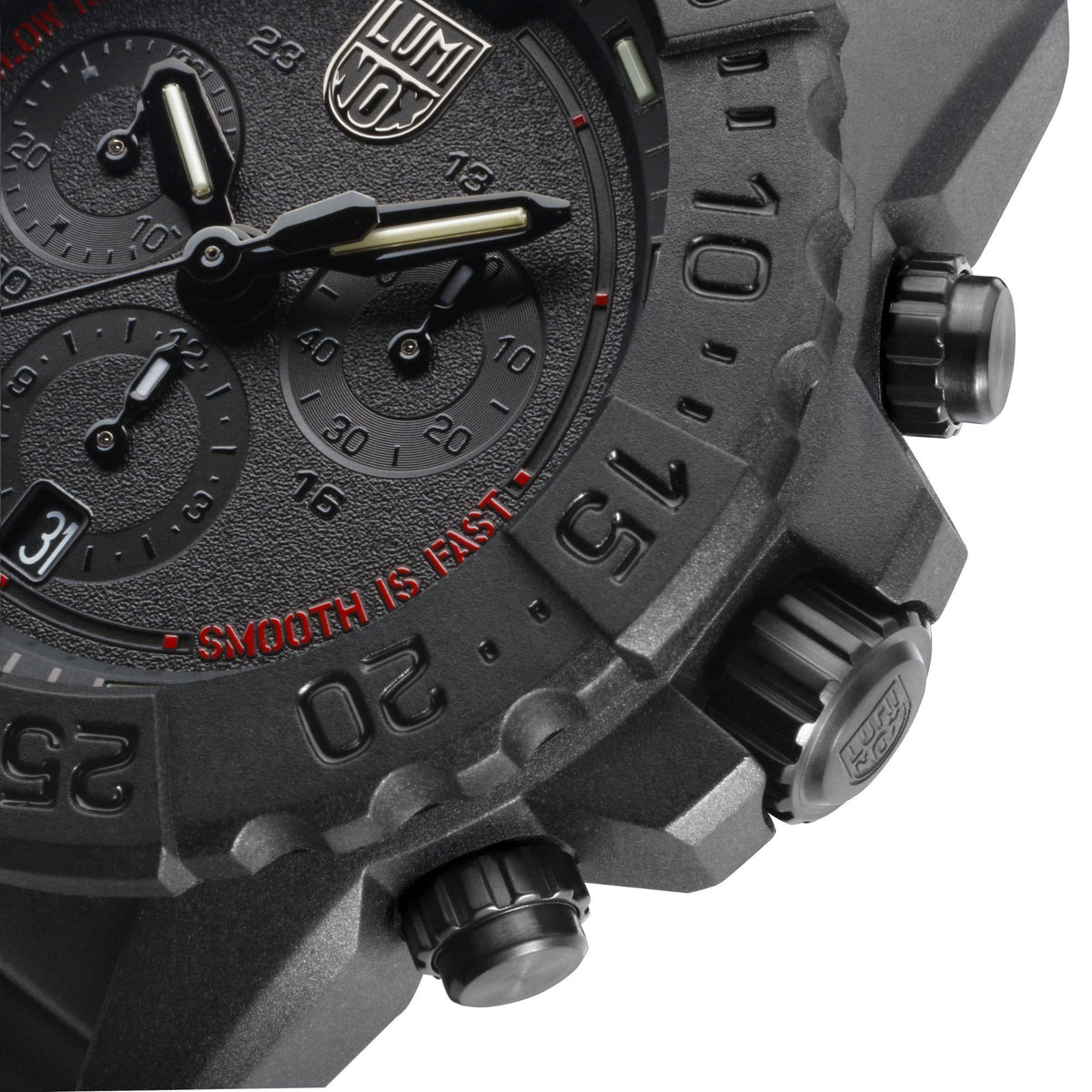 Black chronograph dial close-up with baton hands and side pushers
