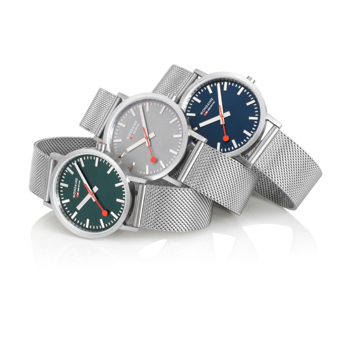 Set of three mesh bracelet watches with dark blue, gray, and green dials and silver cases