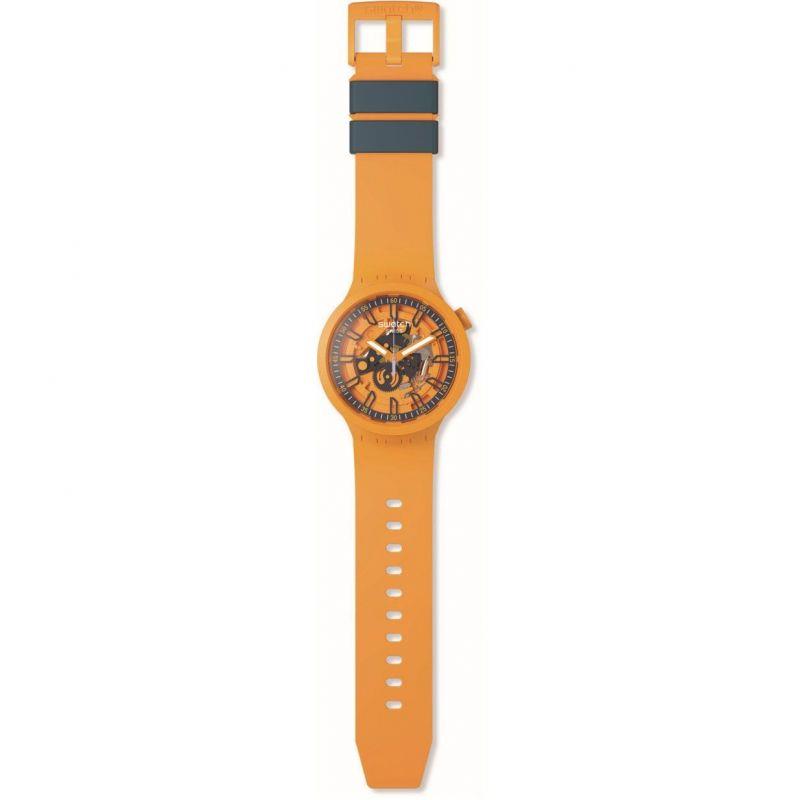 Orange Swatch skeleton dial watch with orange silicone strap and top buckle