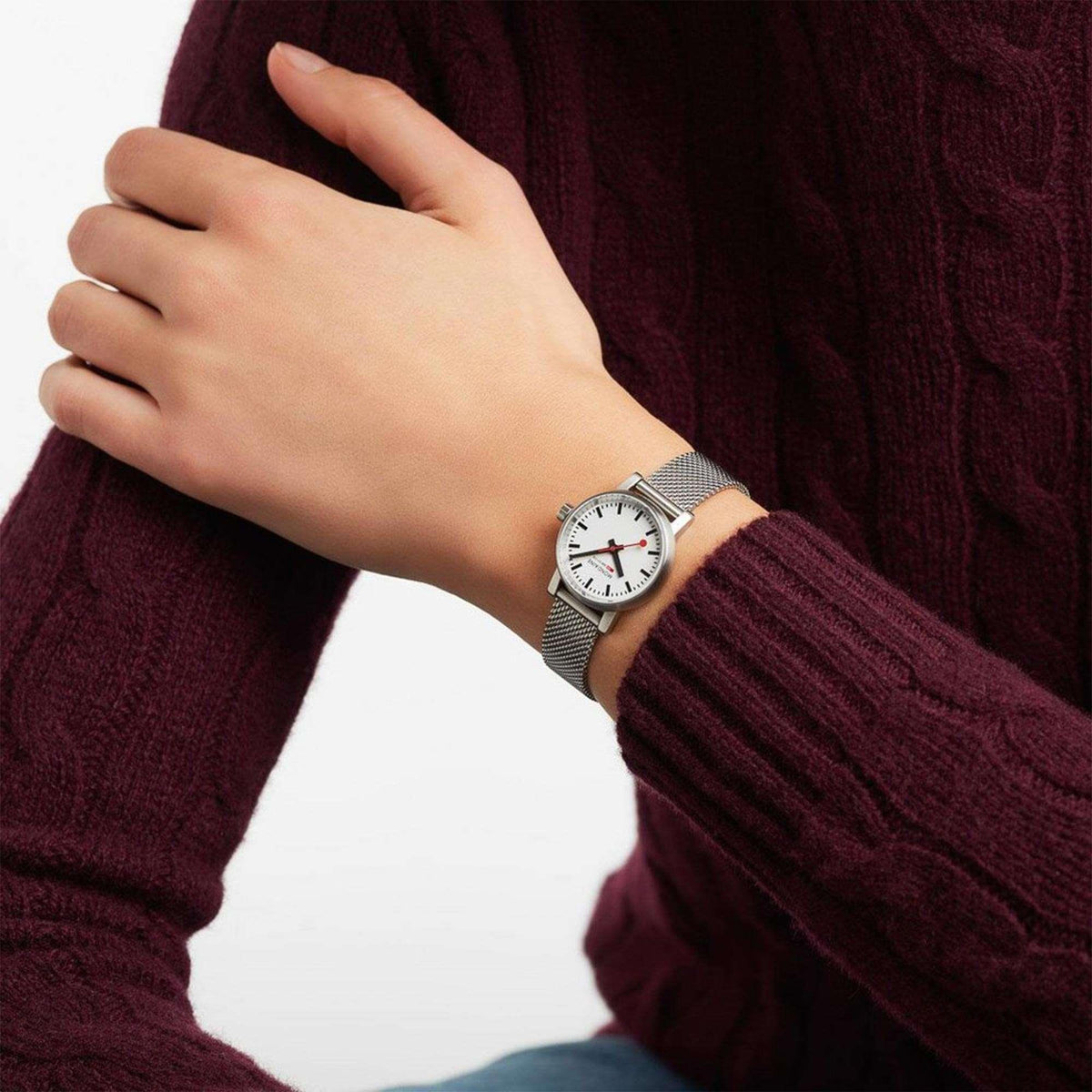 Mondaine Evo2 petite ladies watch worn on wrist, white dial and stainless mesh bracelet