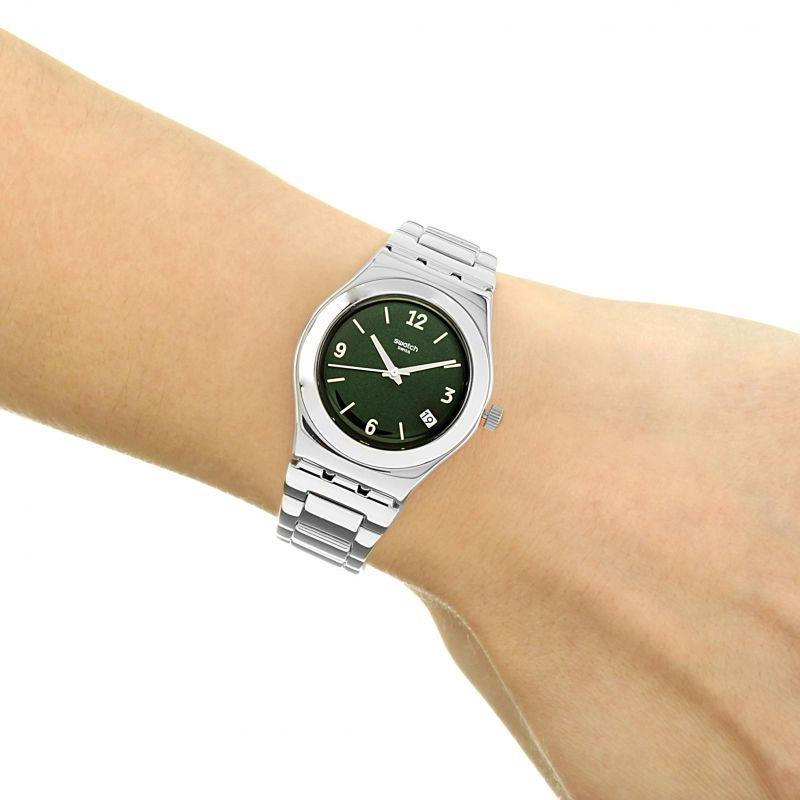 Ladies wristwatch with green dial, silver bezel, and stainless steel link bracelet