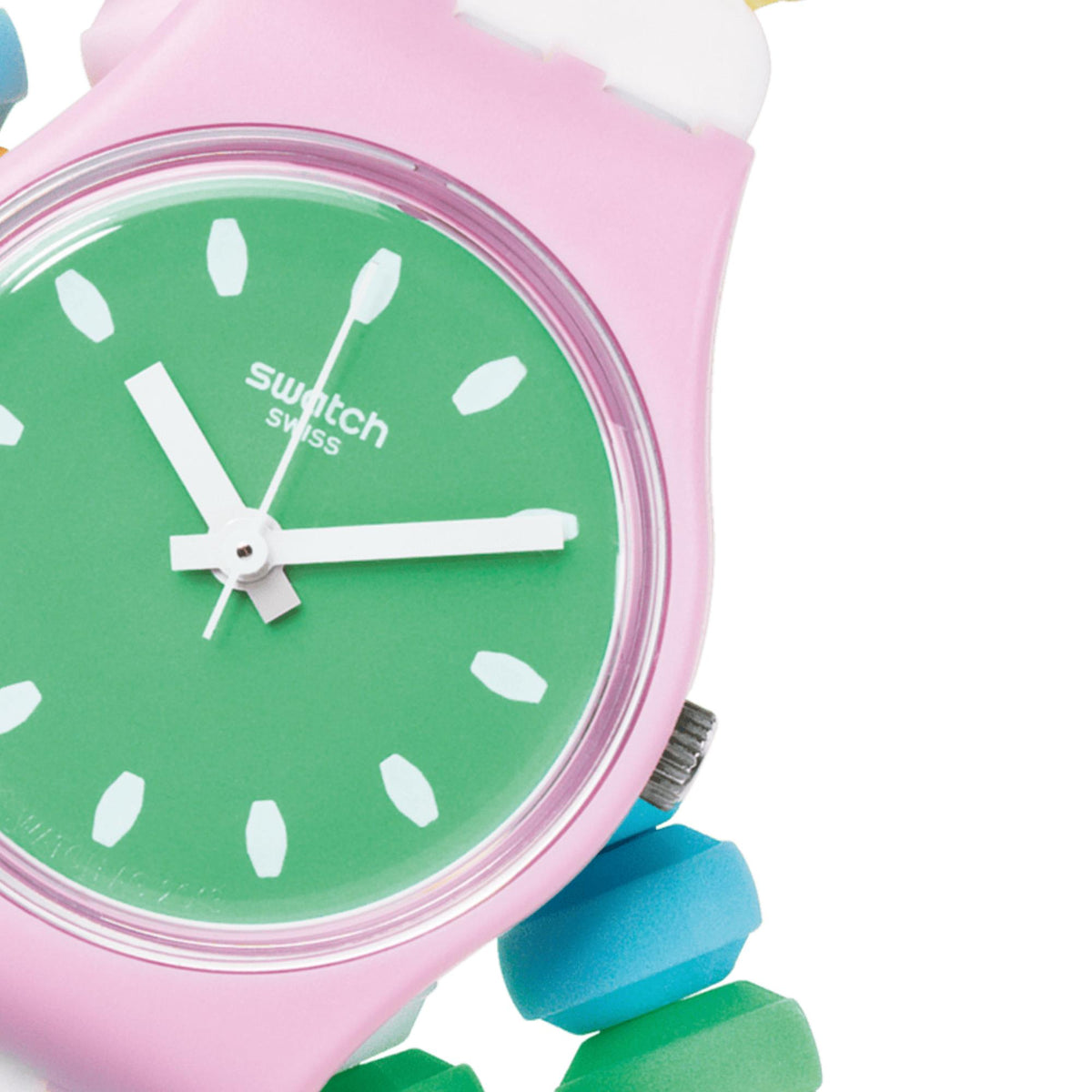 Green dial close-up on pink strap watch, white markers and hands visible