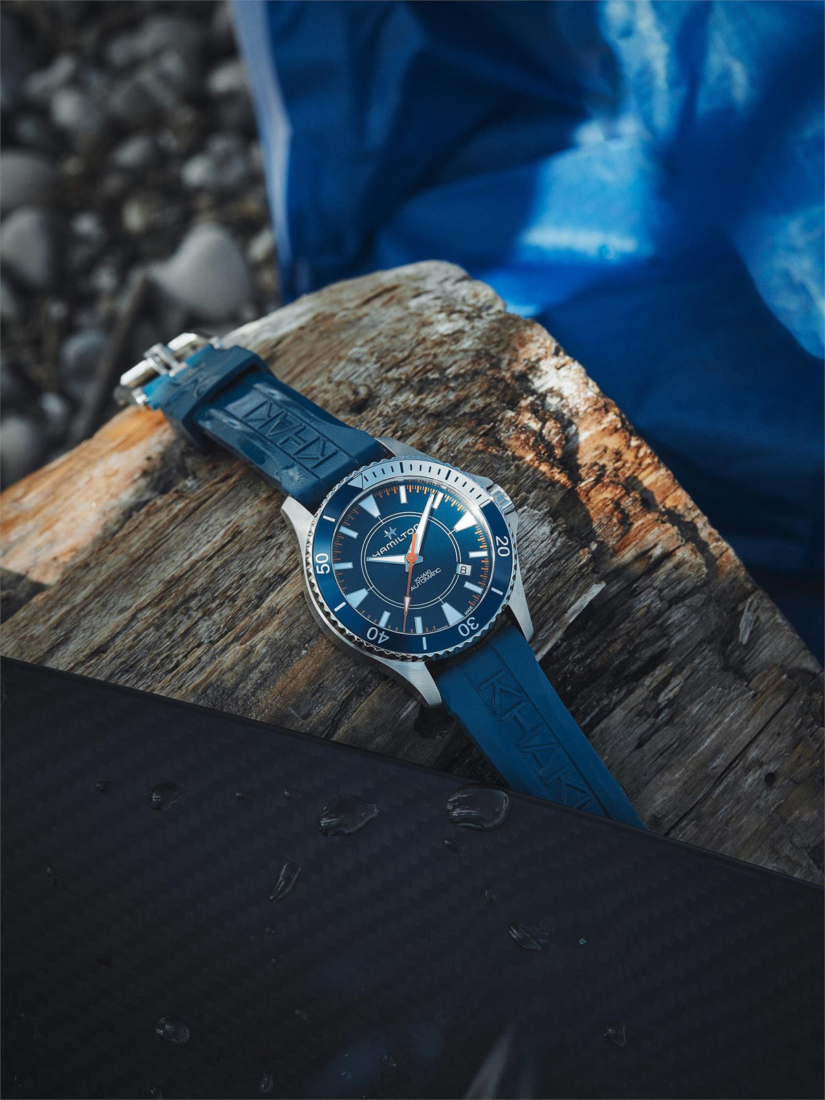 Men's automatic watch with blue dial and blue rubber strap, stainless bezel and case.