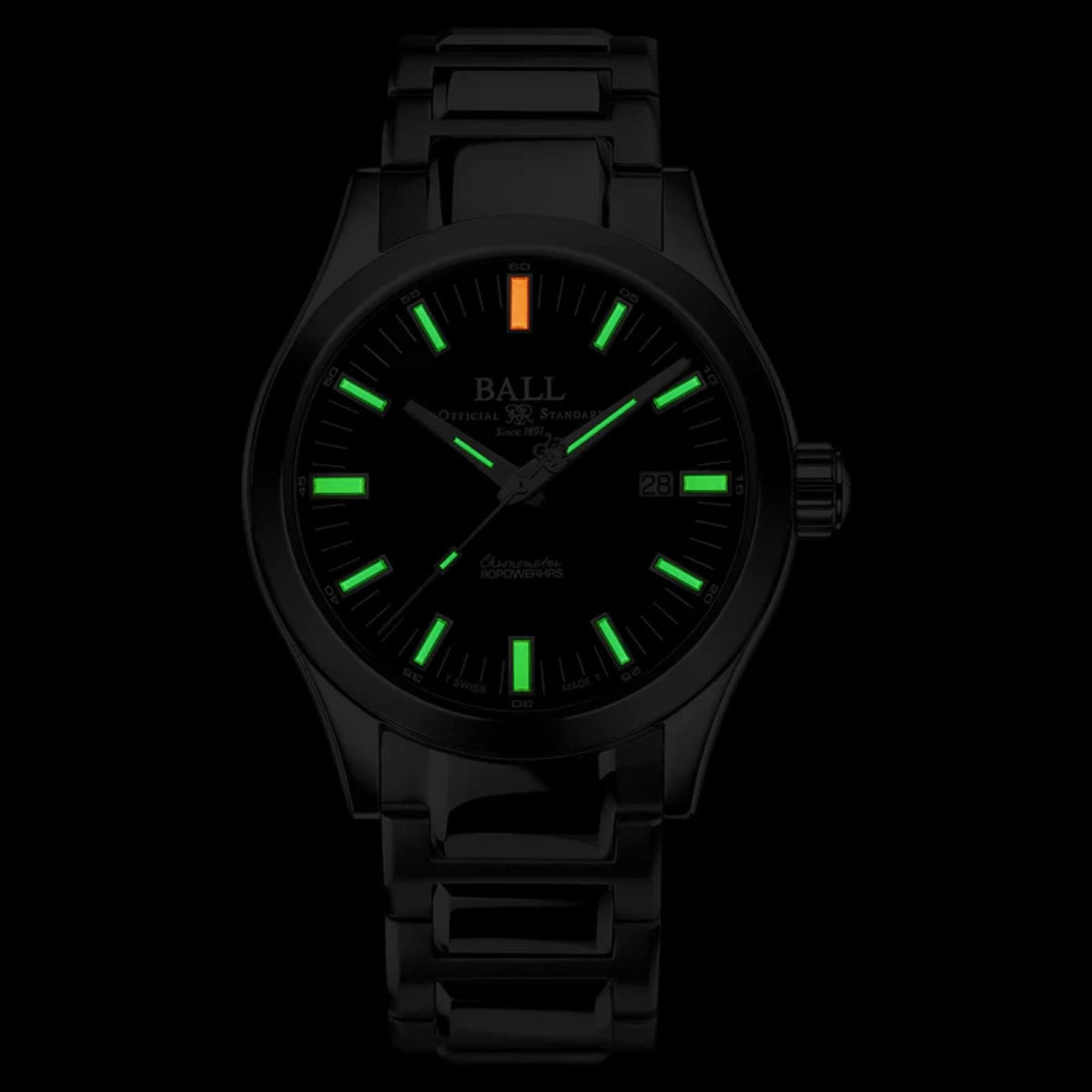 Automatic wrist watch with black dial, luminous green hour markers, dark bracelet, date