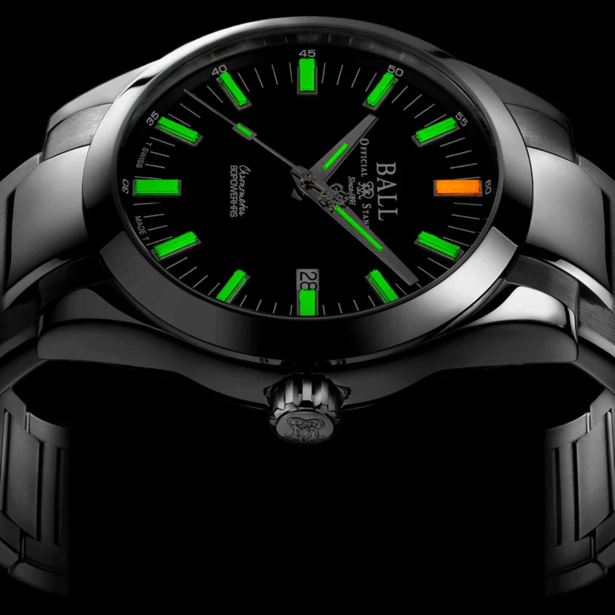 Men's automatic wristwatch with black dial, green luminous markers, stainless steel bracelet