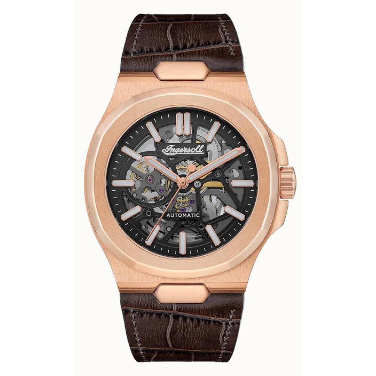 Rose gold skeleton watch with black dial, automatic label, and brown leather strap
