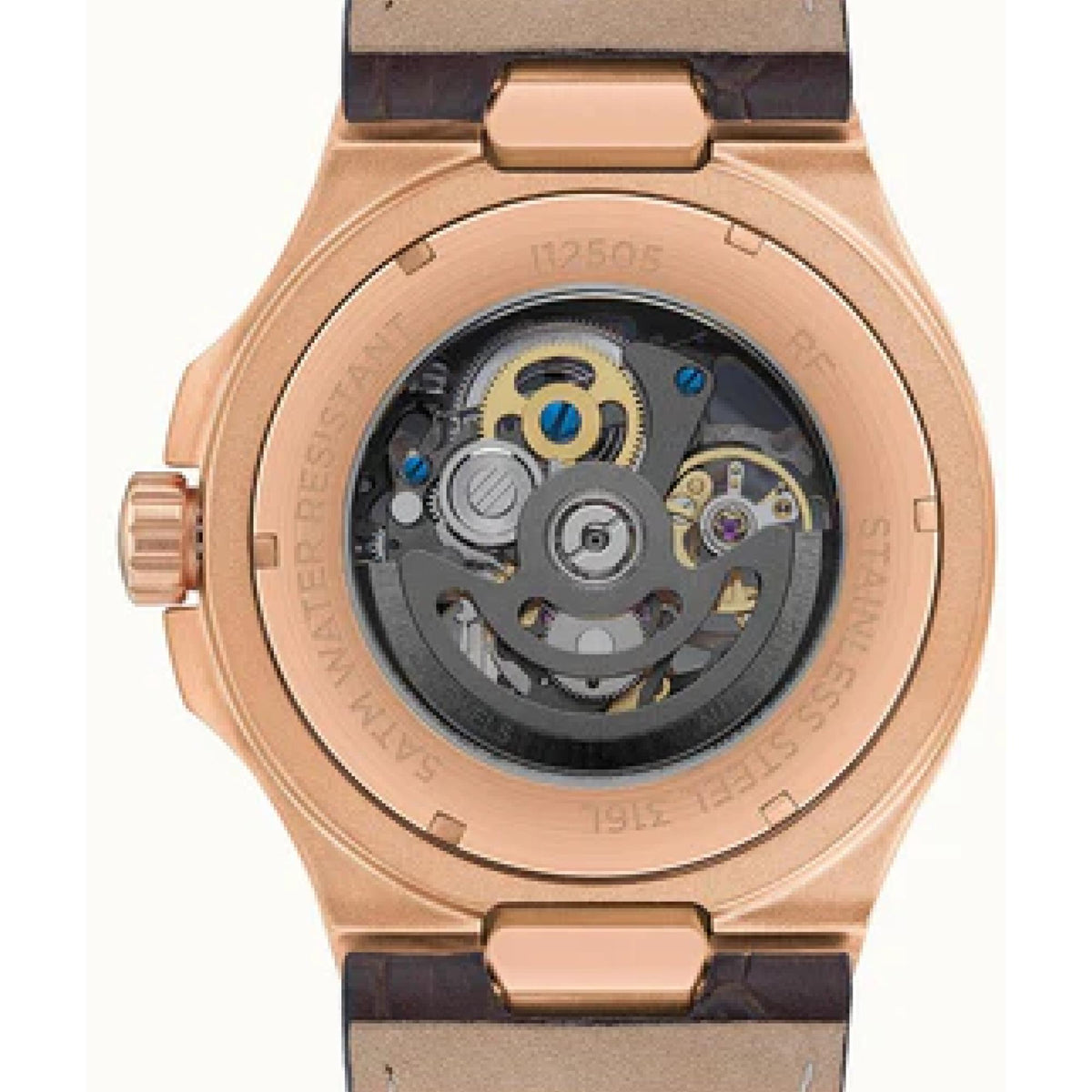 Rose gold case back close-up showing gears on dark movement and brown leather strap