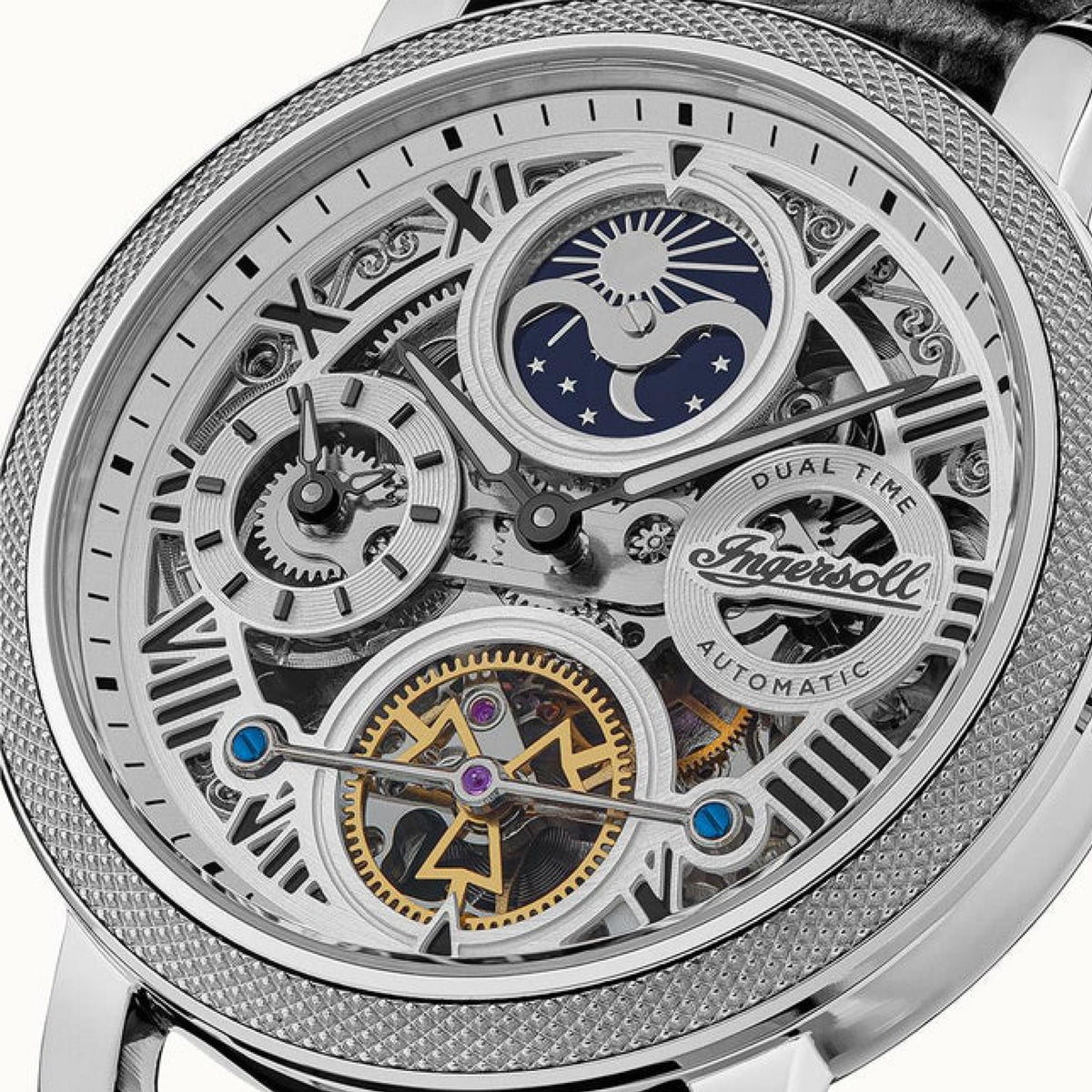 Close-up of men's automatic skeleton dial with blue moon motif, Roman numerals, silver bezel