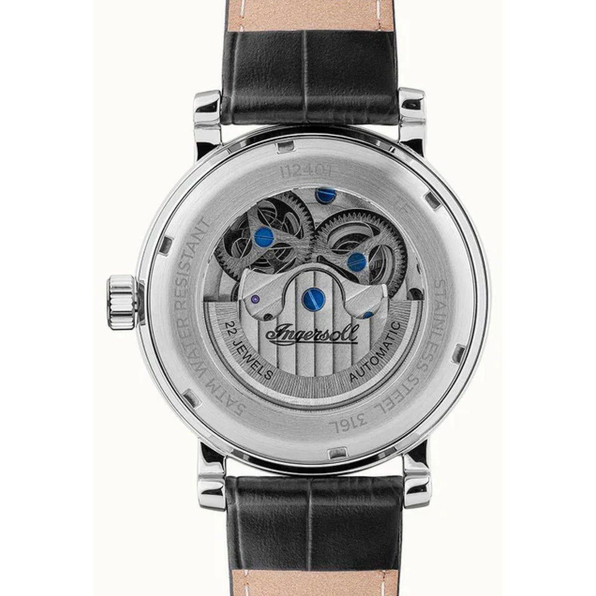Back view of men's automatic skeleton watch with black leather strap and engraved case