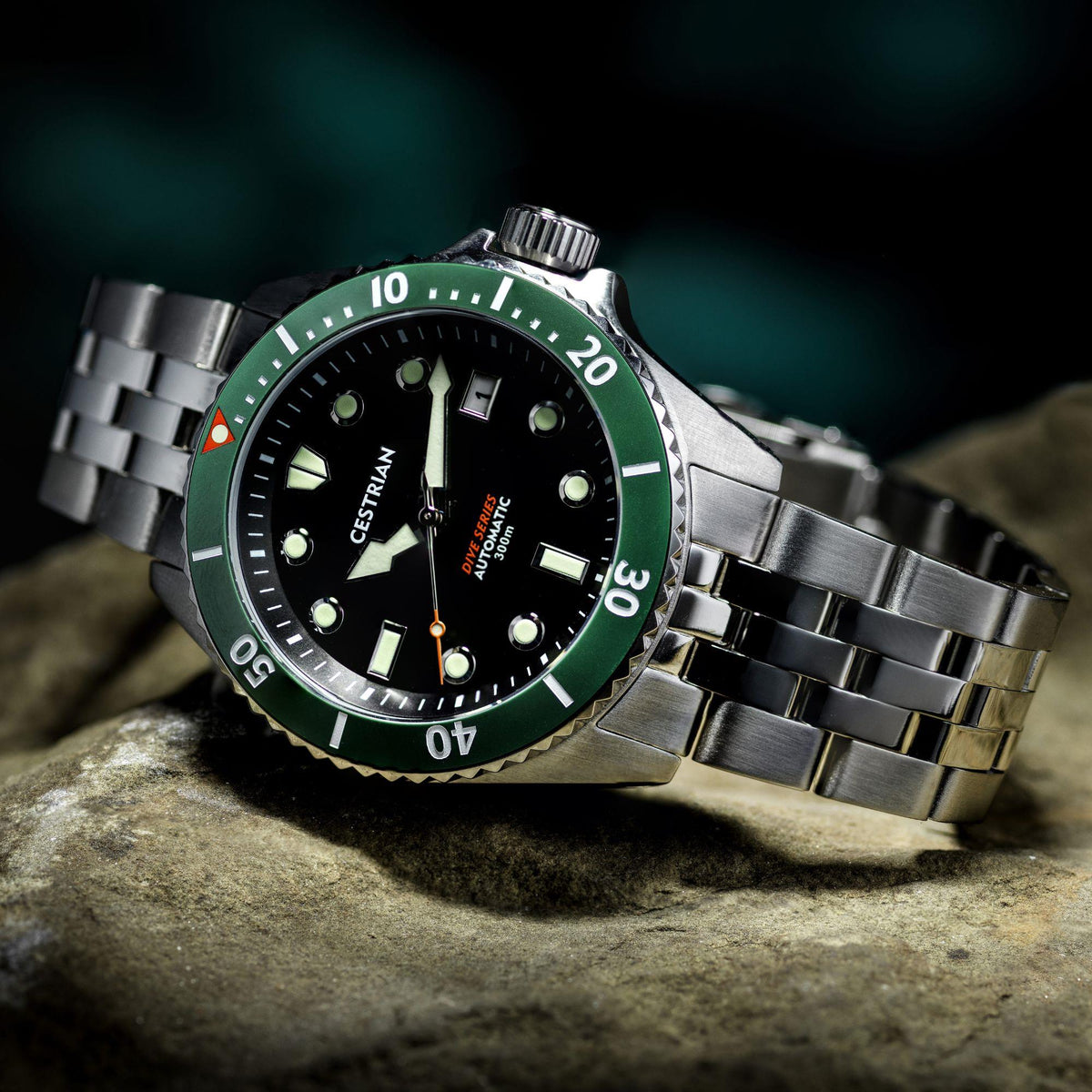 Men's automatic dive watch with black dial, green ceramic bezel, steel bracelet