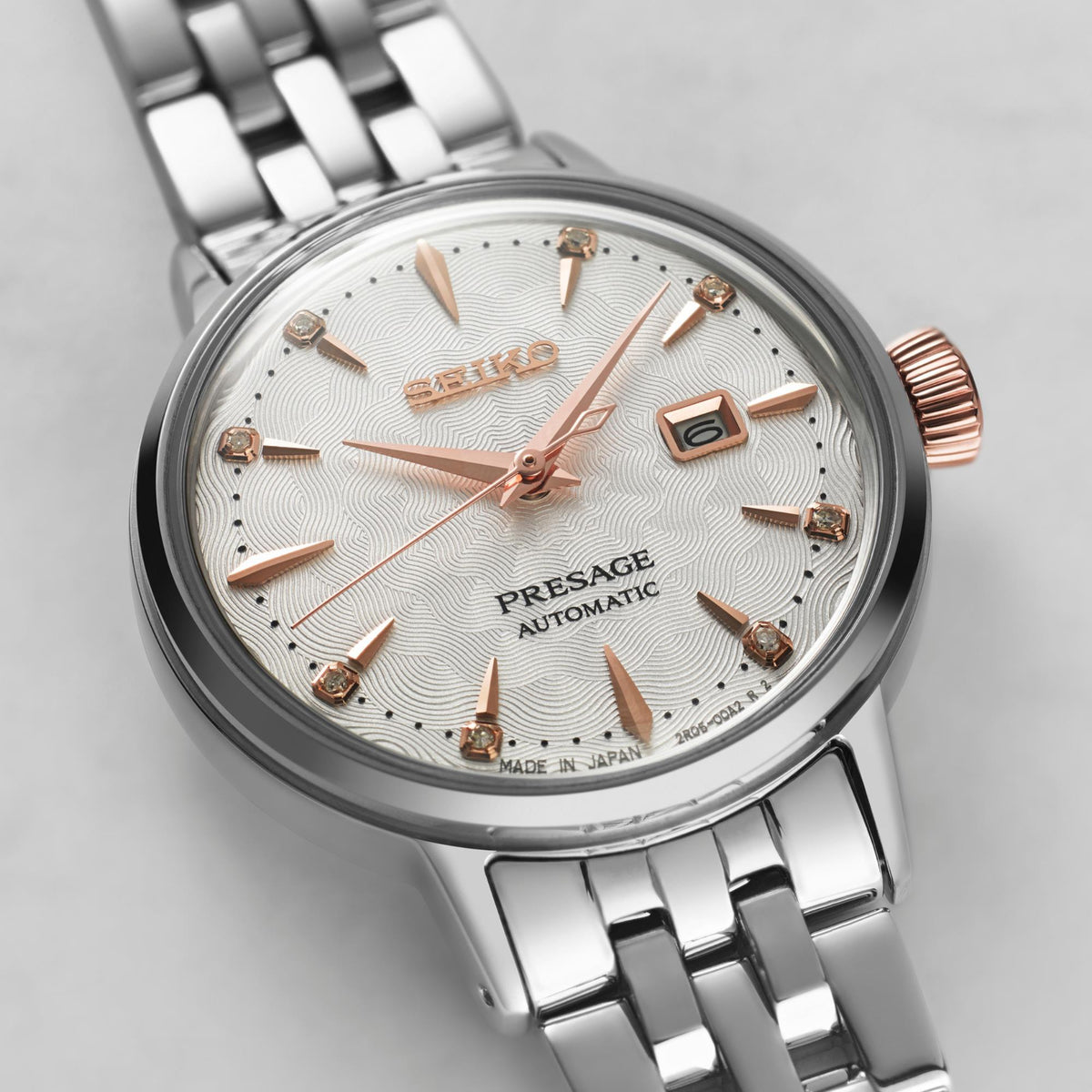 Seiko Presage ladies watch close-up: white dial with gold details, steel case and bracelet