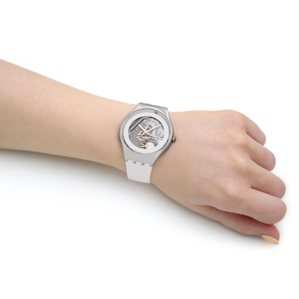 Men's wristwatch on arm: white strap and silver case with exposed movement