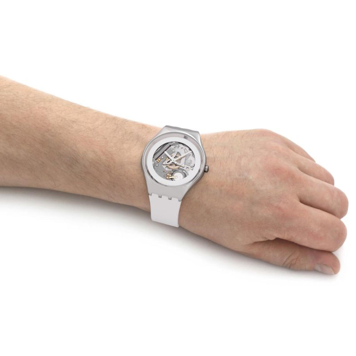 Men's wristwatch close side view on arm, white strap and silver skeleton dial