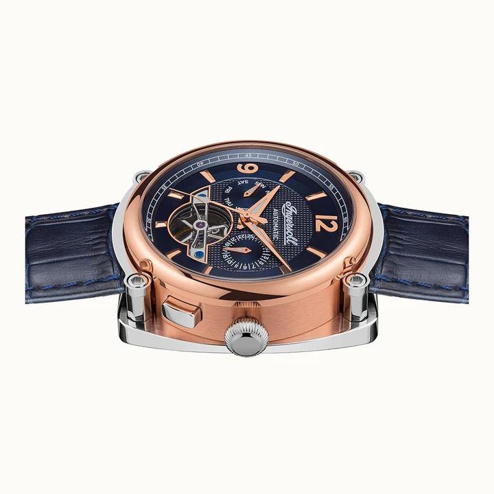 Men's automatic watch angled view: rose-gold case, dark blue dial, blue leather strap