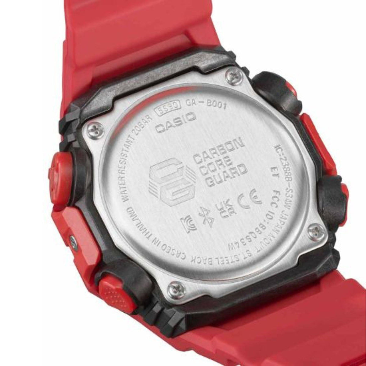 Red G-Shock watch case back with metal plate labeled Carbon Guard