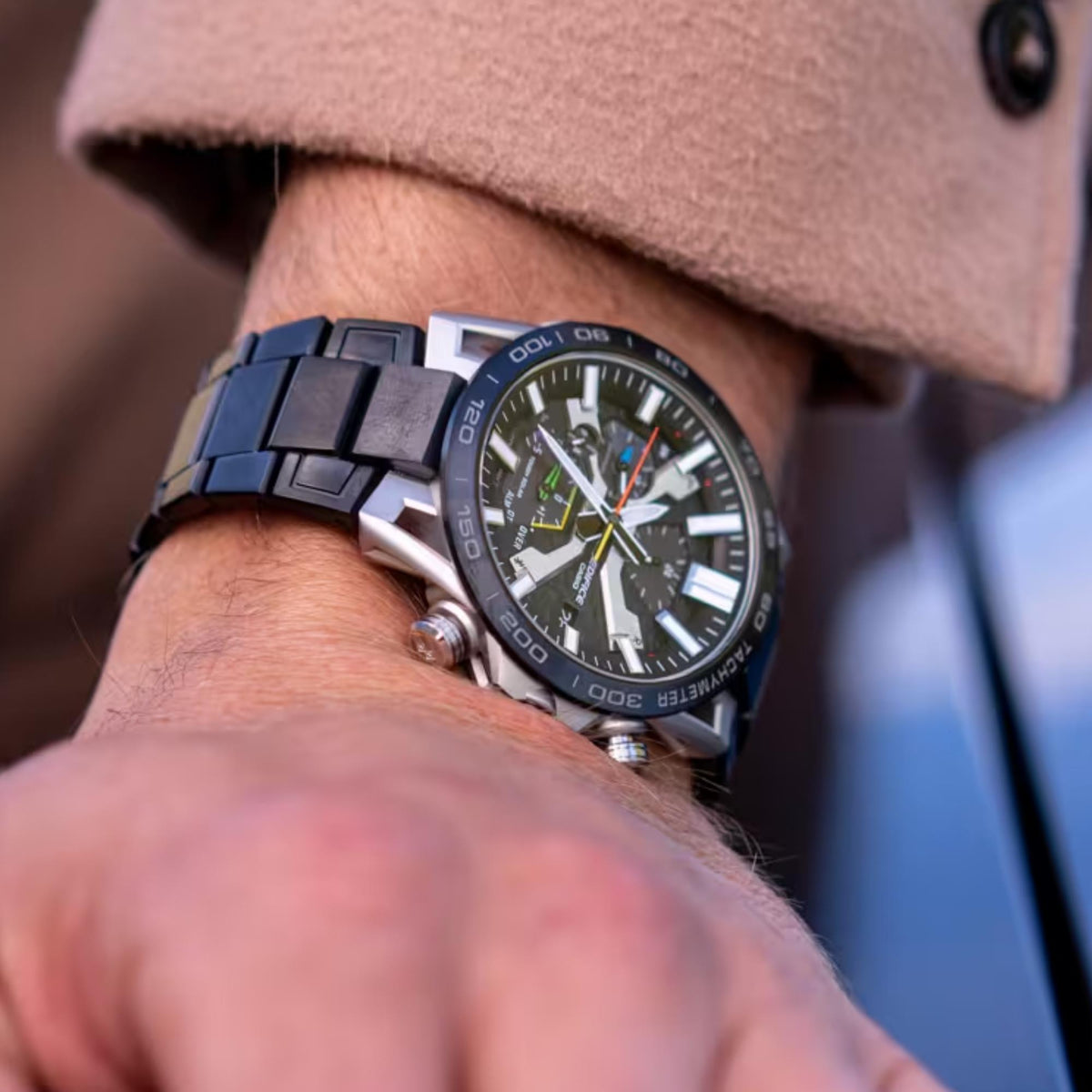 Men's solar Bluetooth chronograph watch with dark grey dial and metal link bracelet, close-up