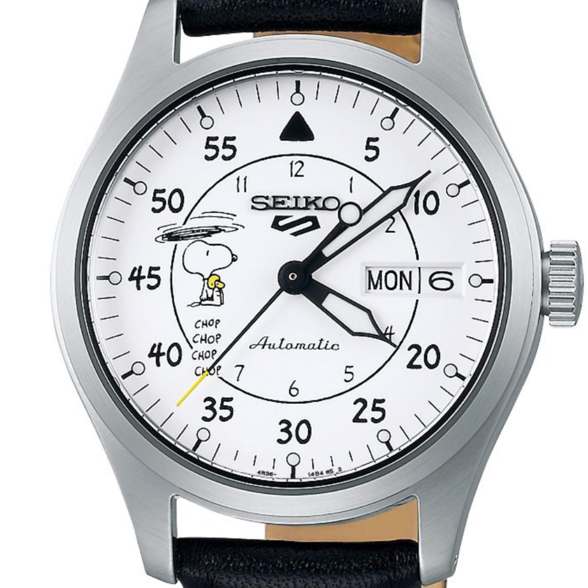 Automatic watch close-up of white dial showing Snoopy graphic and day window