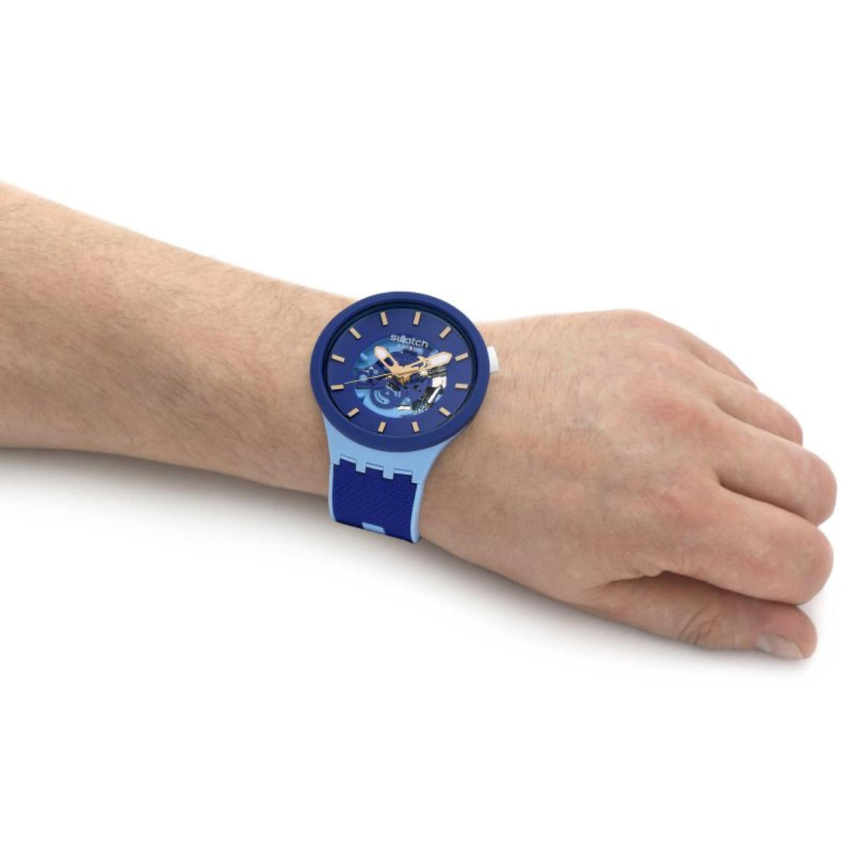Blue wristwatch close-up on wrist with dark blue dial and blue textured band