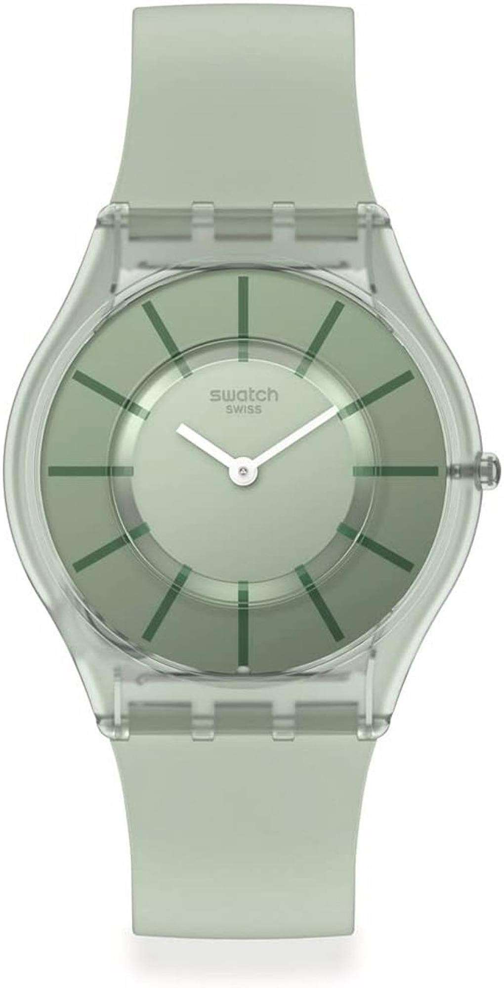 Swatch wristwatch with translucent silver case, light green strap, striped green dial.