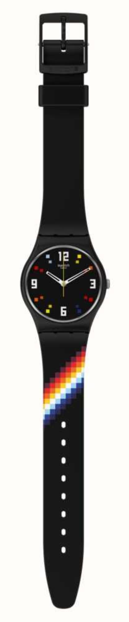 Black Swatch wristwatch side view with black strap and rainbow stripe, face with colored markers.