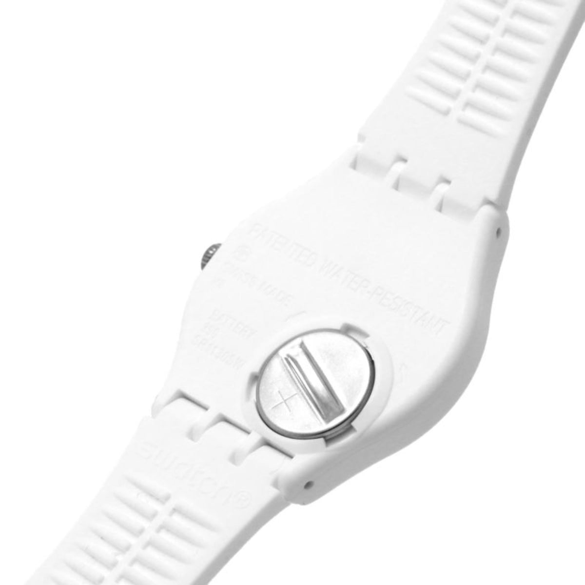 White Swatch watch caseback with round metal medallion and strap attachment