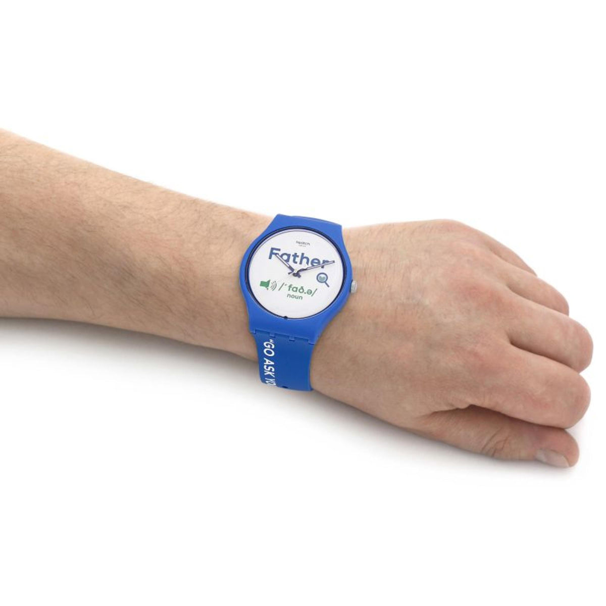 Blue silicone strap watch with white dial on bare wrist, “Father” text visible
