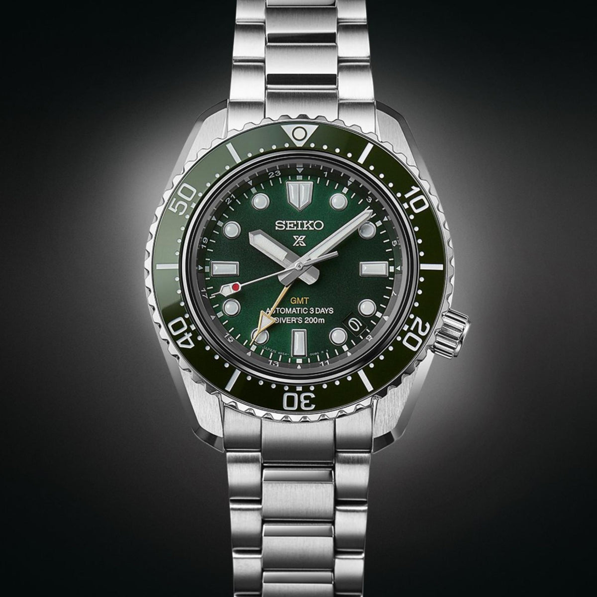 Seiko Prospex GMT diver watch front view with green dial, steel case, and bezel