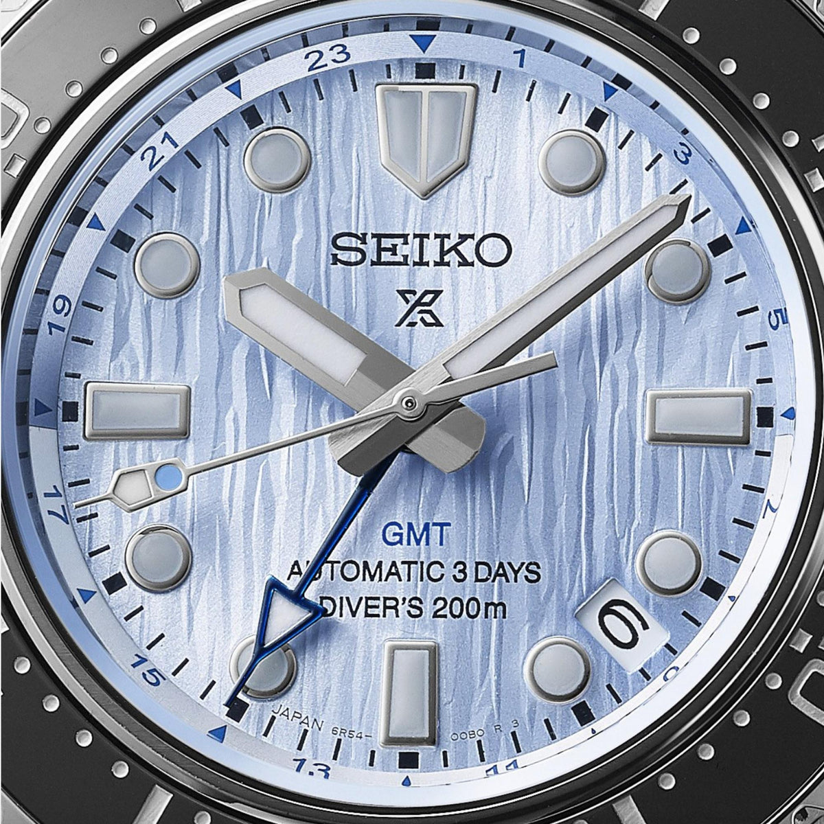 Men's blue dial wristwatch close-up with SEIKO logo, GMT and 3-day text