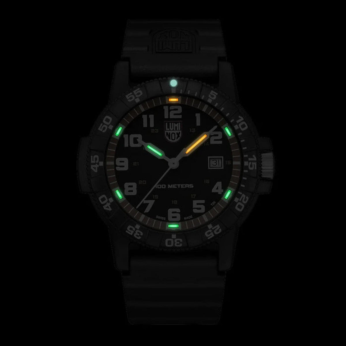 Black men’s watch with luminous dial accents and orange second hand on dark background