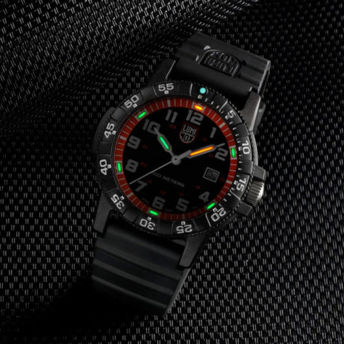 Black men’s sport watch angled view, orange ring detail, glowing green numerals