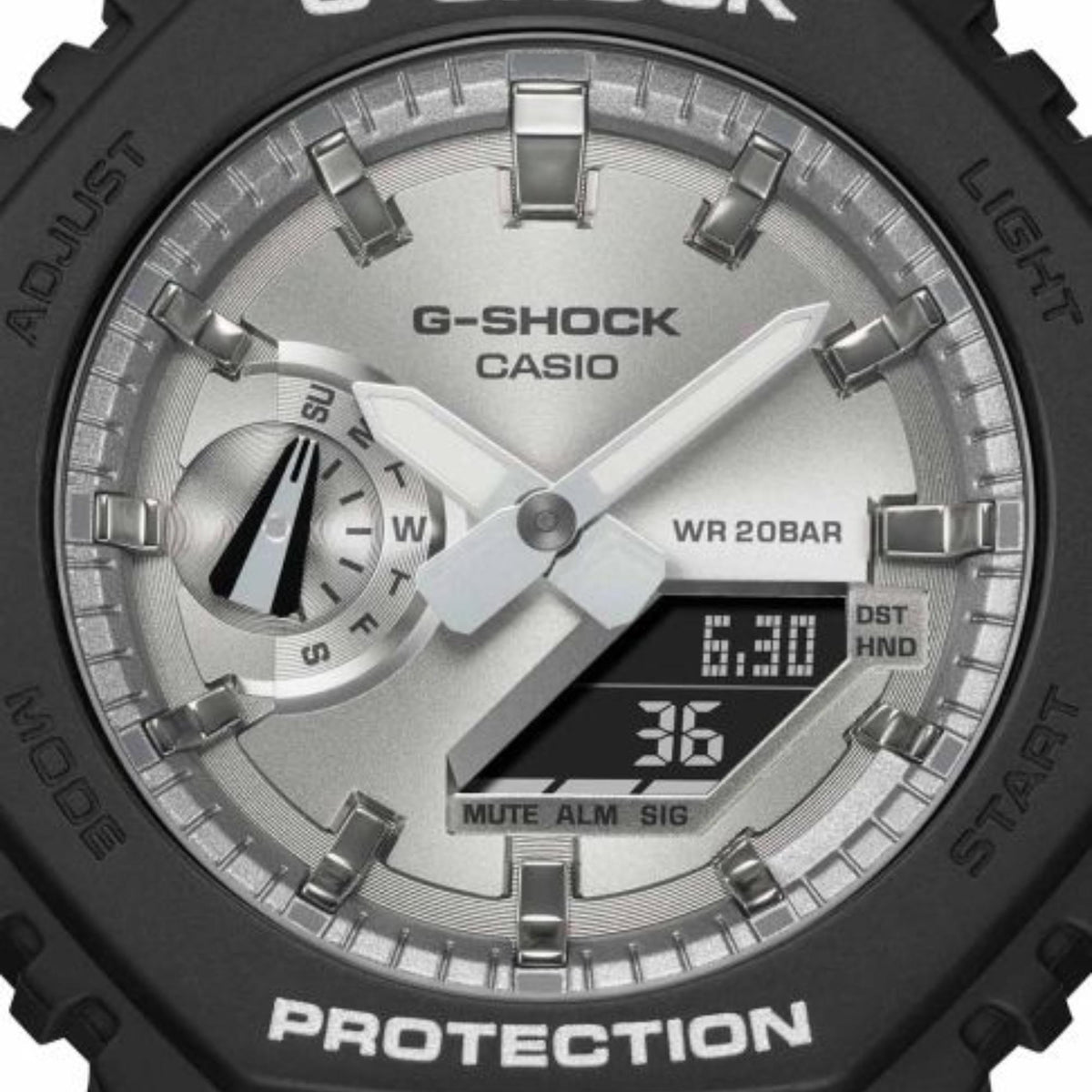 Men's Casio G-Shock dial close-up, silver face with WR 20BAR text, analog hands and digital.