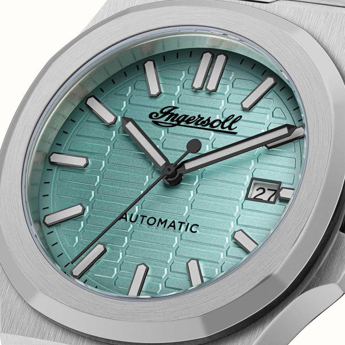Men's Ingersoll automatic watch with turquoise dial close-up, steel case, hour markers and hands