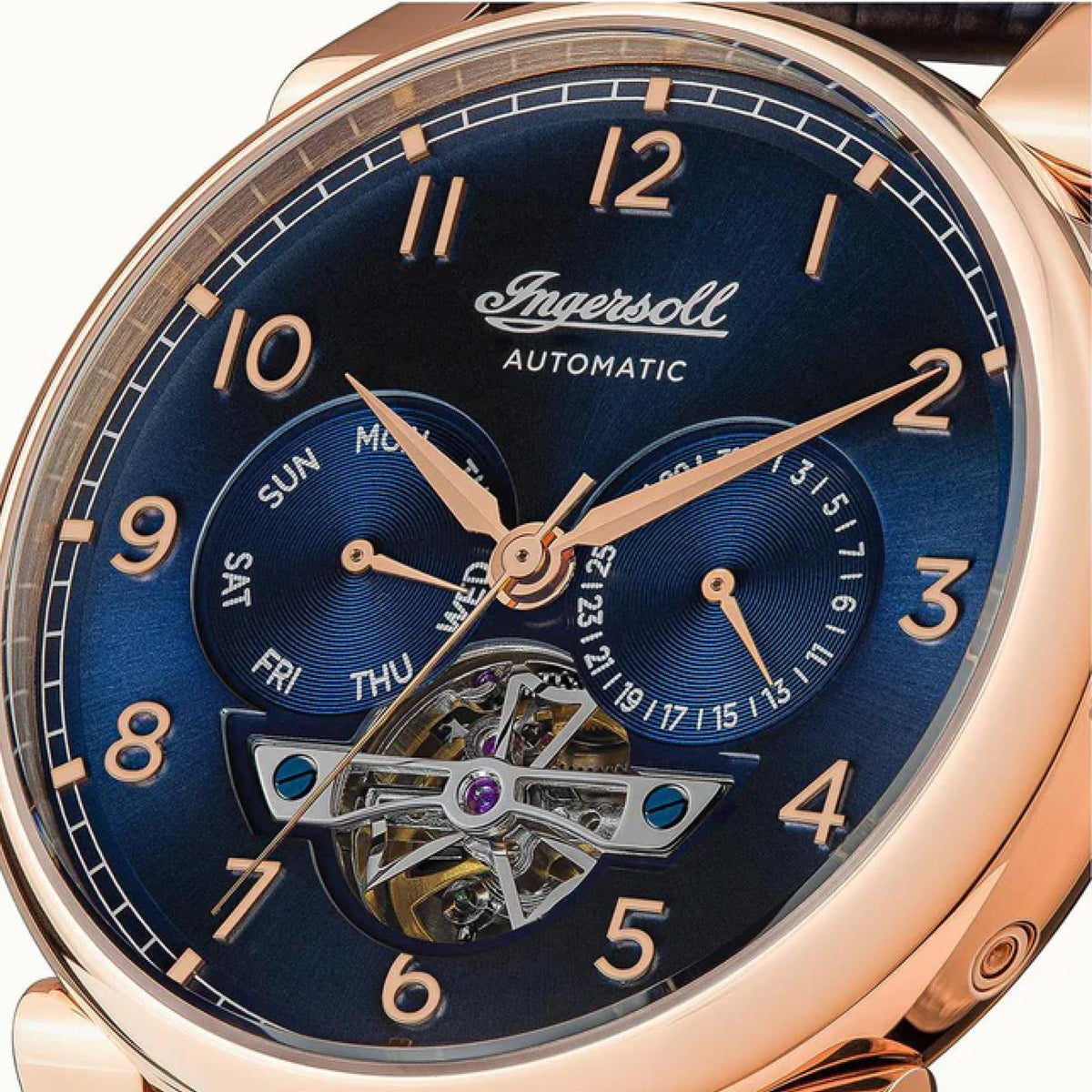 Automatic gents watch with blue dial and rose-gold case, visible skeleton movement