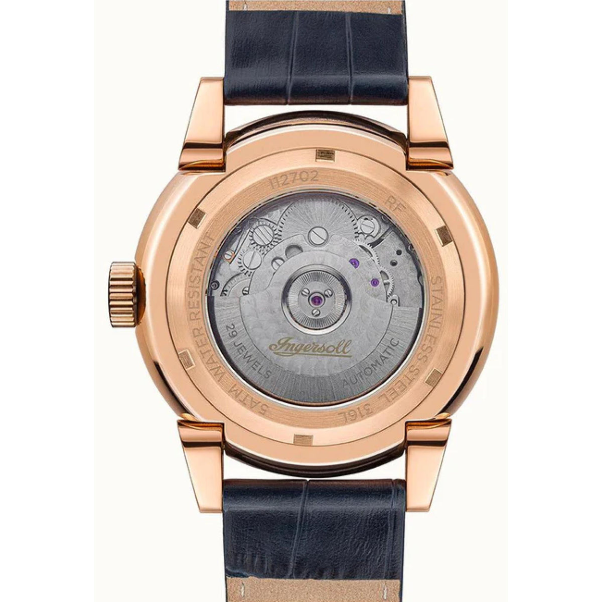 Automatic watch case back showing metal movement, blue leather strap