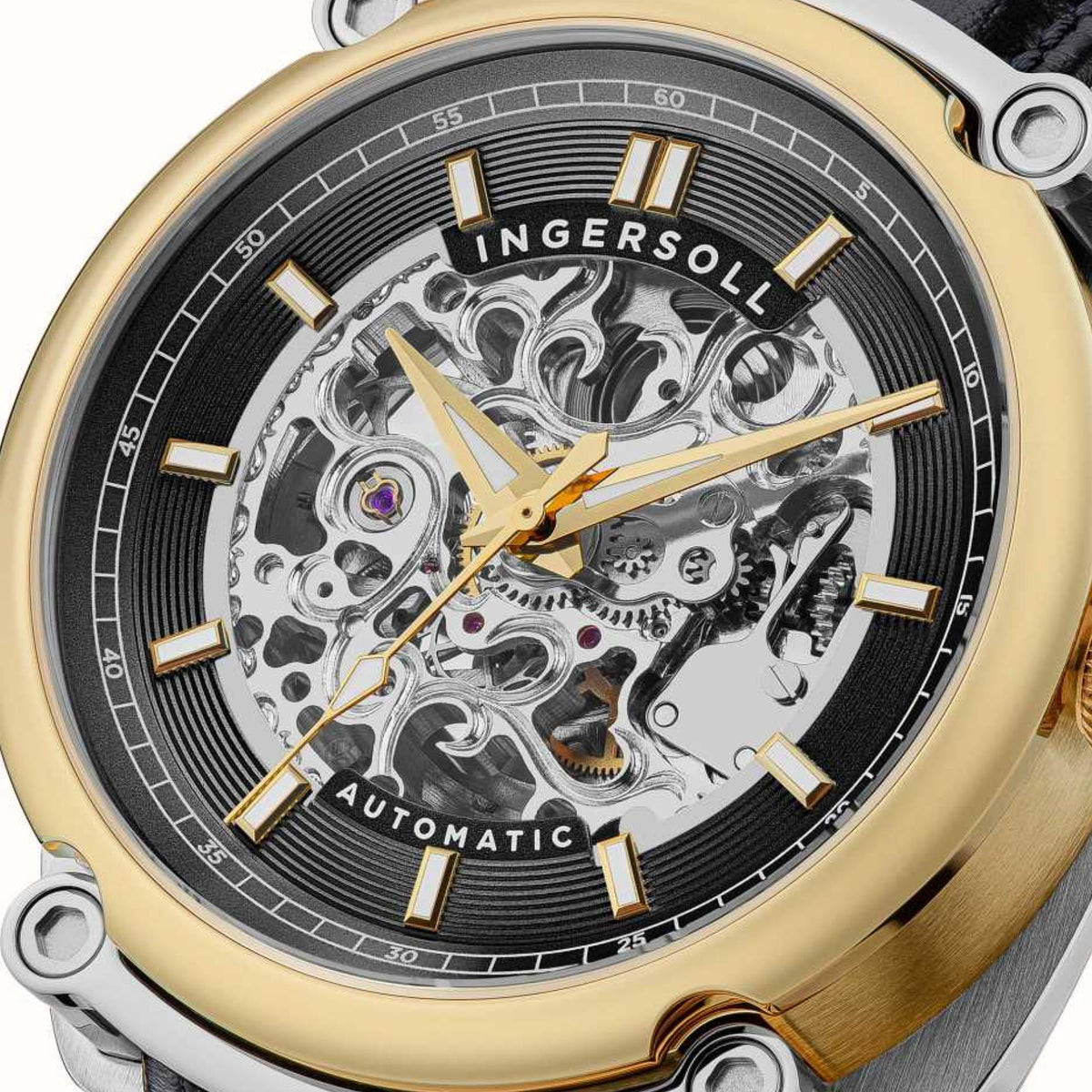 Close-up of automatic watch black dial with gold hands and visible gears