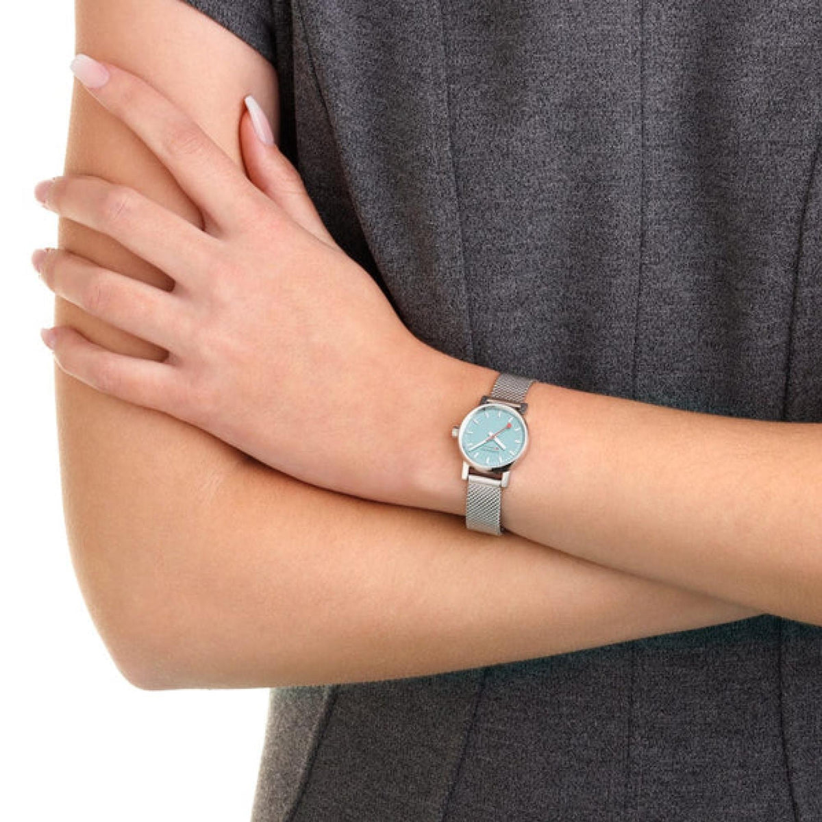 Stainless steel ladies watch with blue dial and silver link bracelet, worn on wrist