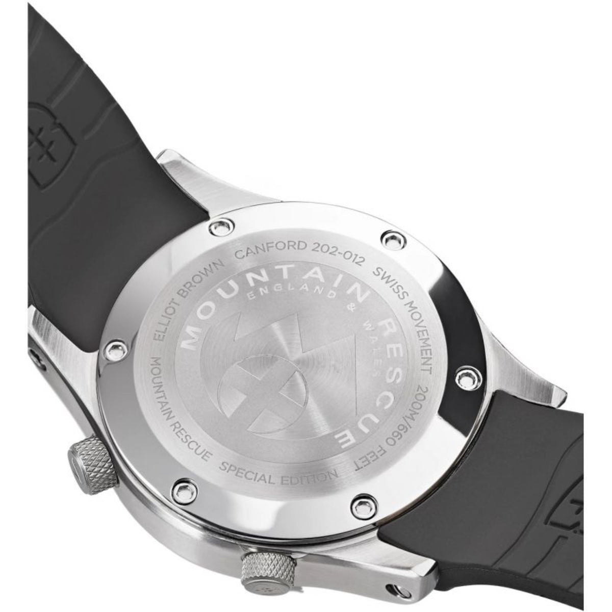 Silver-tone watch caseback with engraved crest on black rubber strap